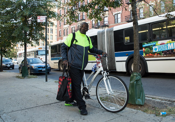 person with bike and tree