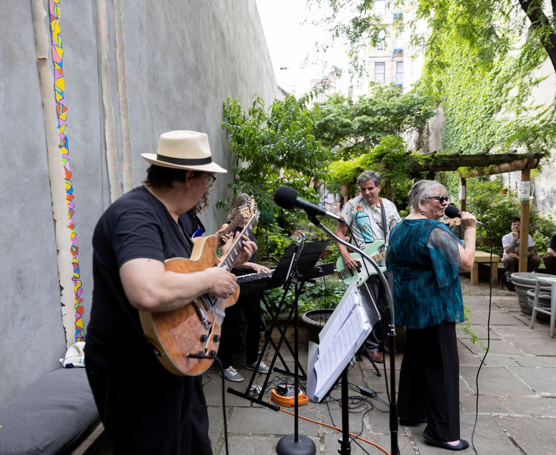 A bad plays music in the garden