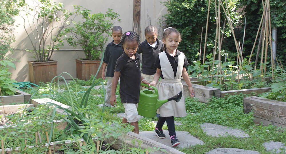 children watering plants