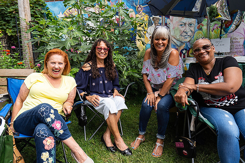 gardeners laughing in community garden