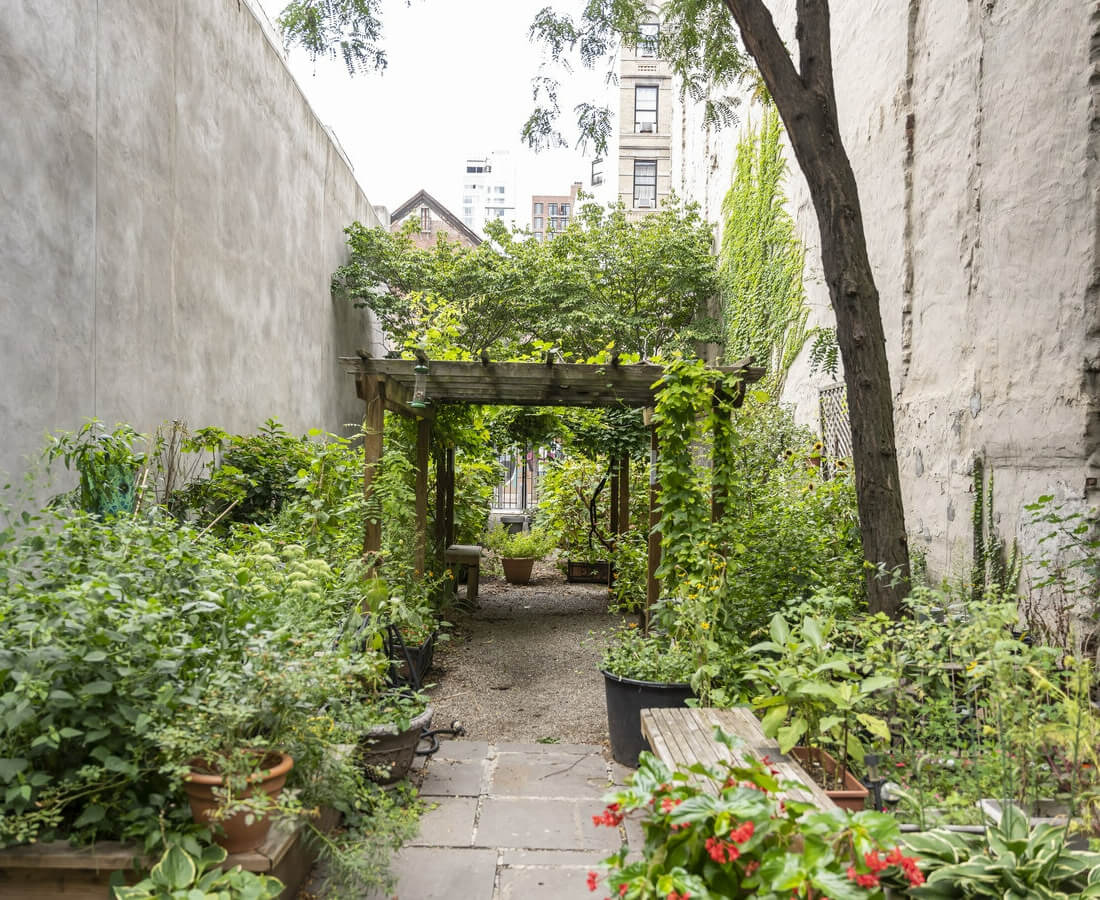 garden after restoration with trellis archway