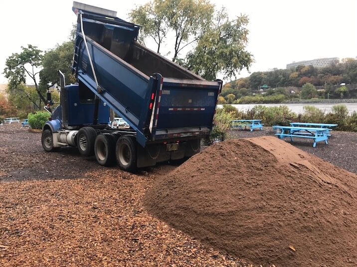 truck dumping compost