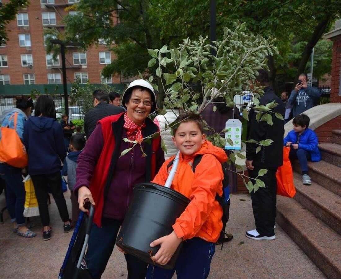 people posing with a tree