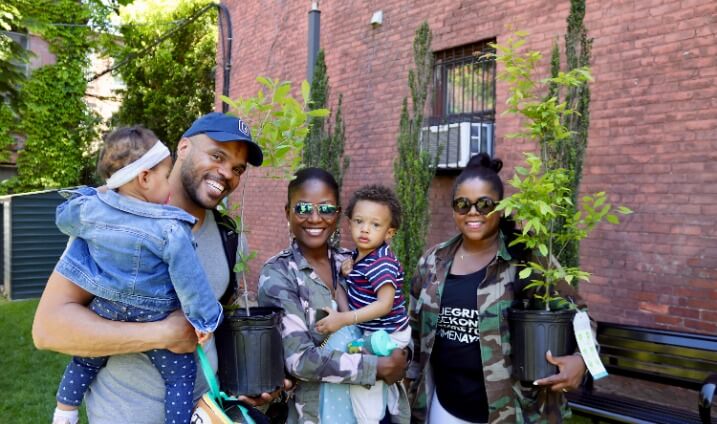 family holding free trees