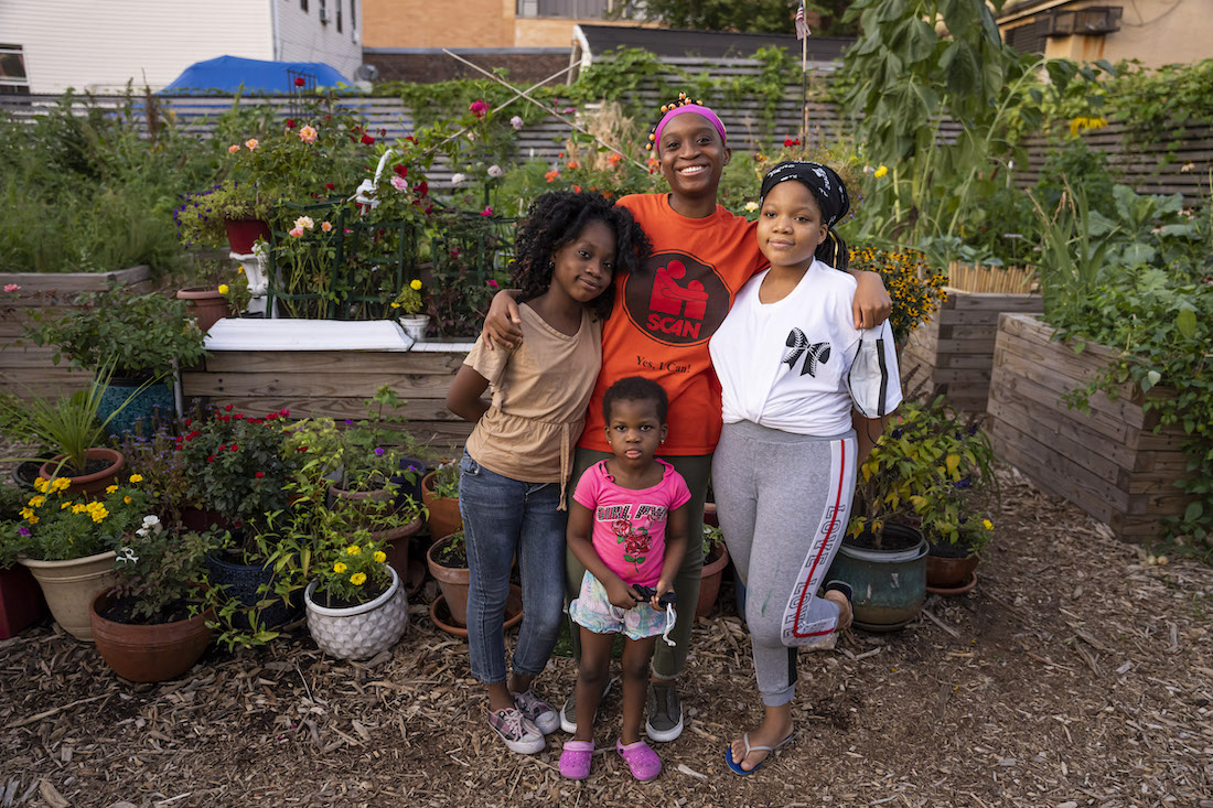 Family smiling in a garden