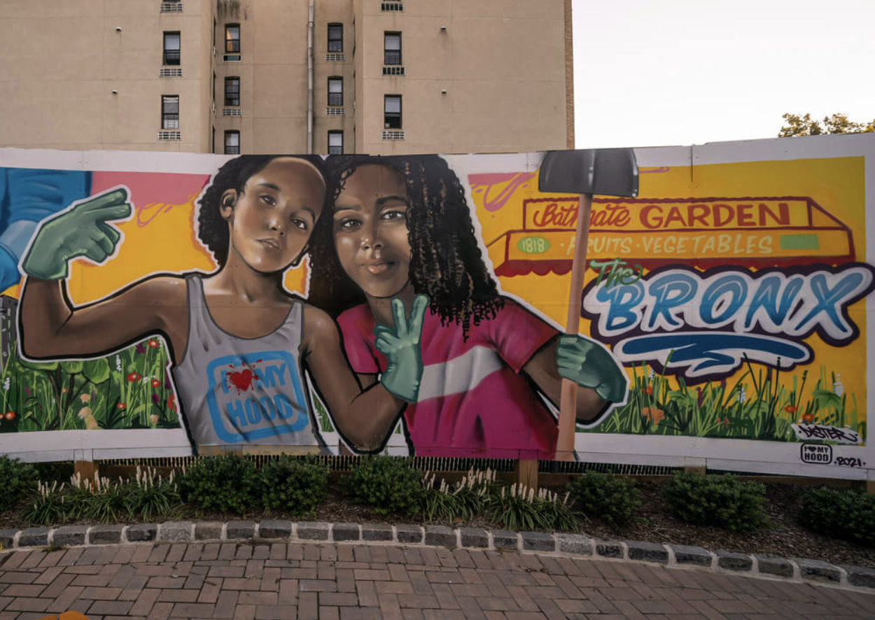 garden mural with two children holding tools