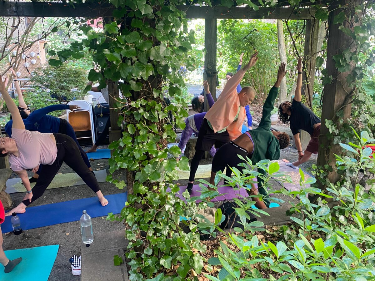 People doing yoga at Maggie's Garden
