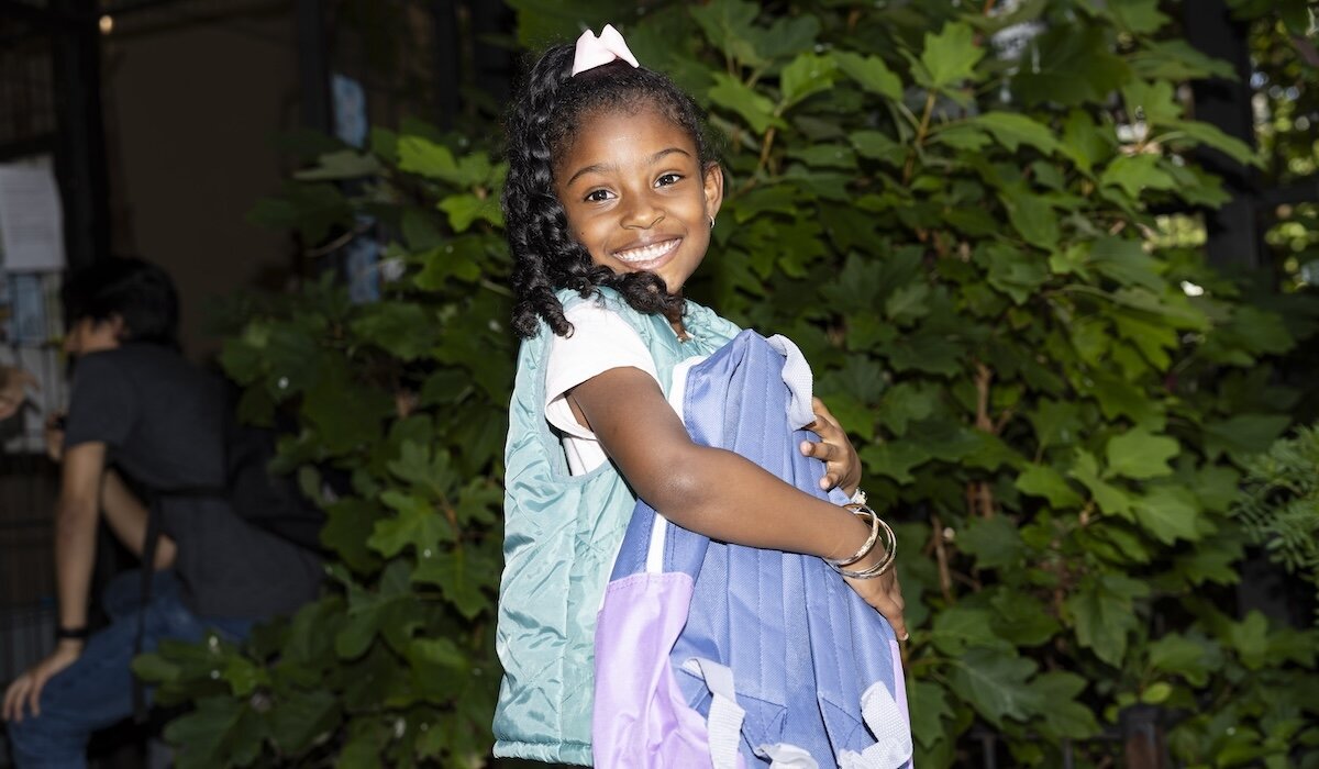 child with backpack