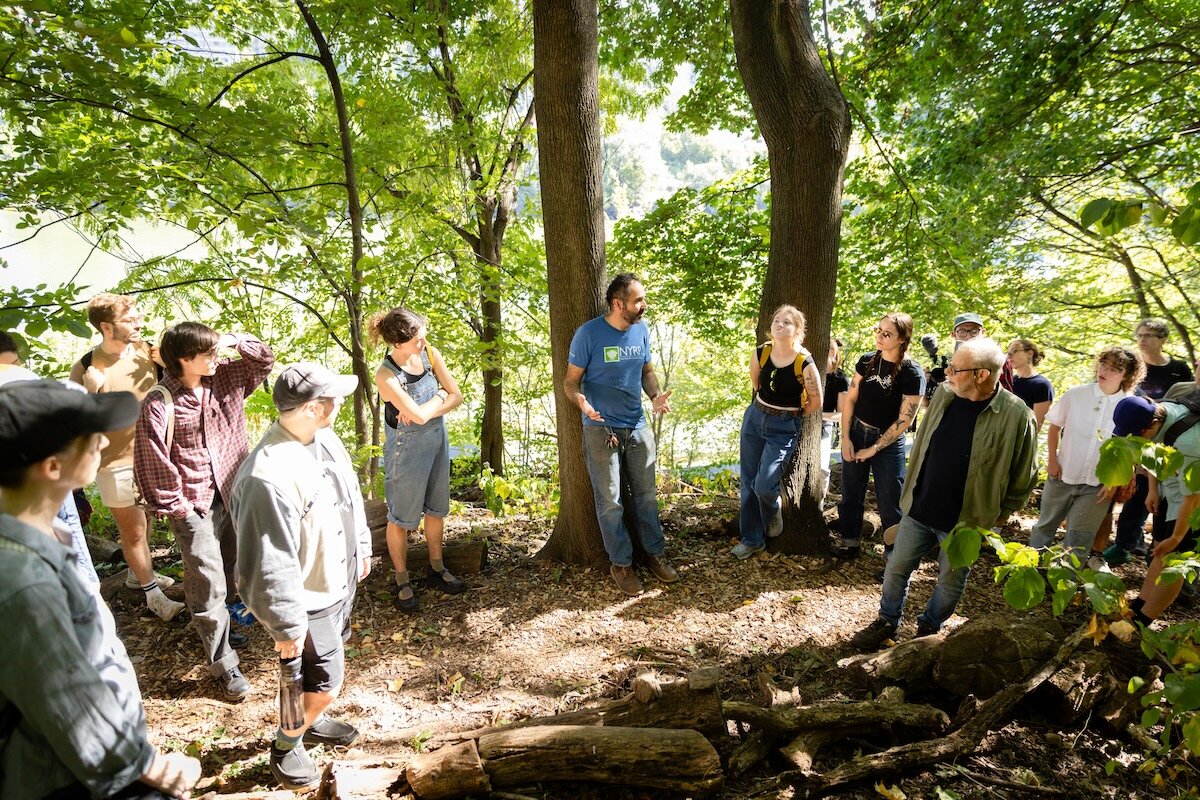 people standing along trail